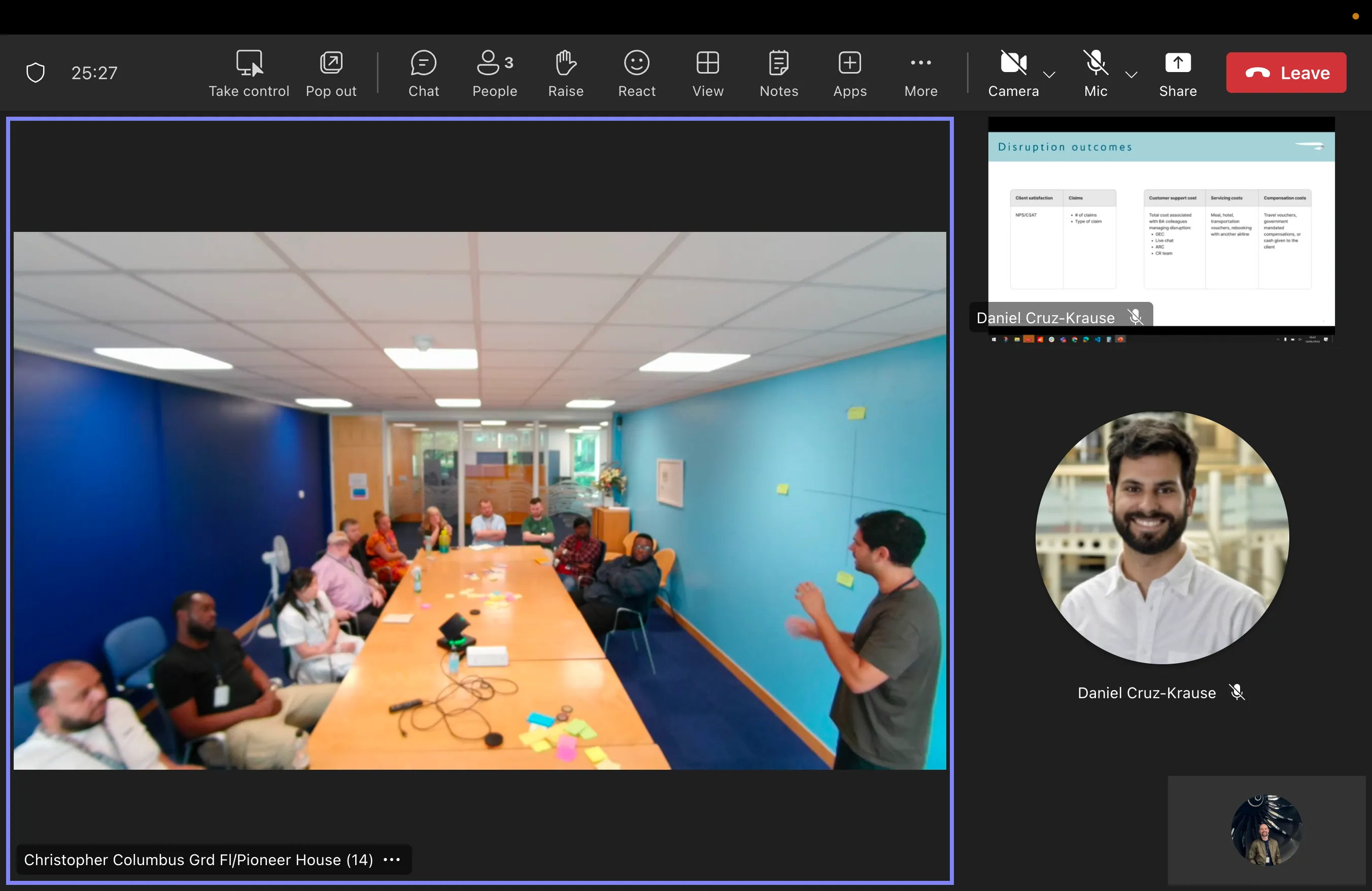A video call of the workshop at BA’s disruption call centre in Manchester, with staff around a meeting table.